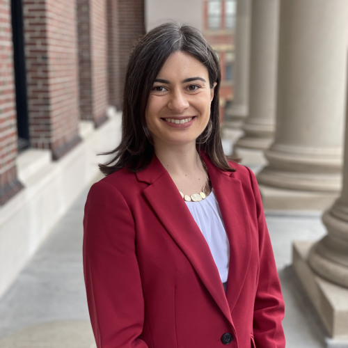 Emily Mitchell standing in front of a brick building